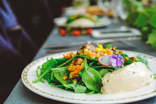 Vegan Spinich Salad on a White Plate