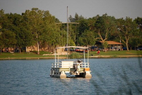 small sail boat on a lake